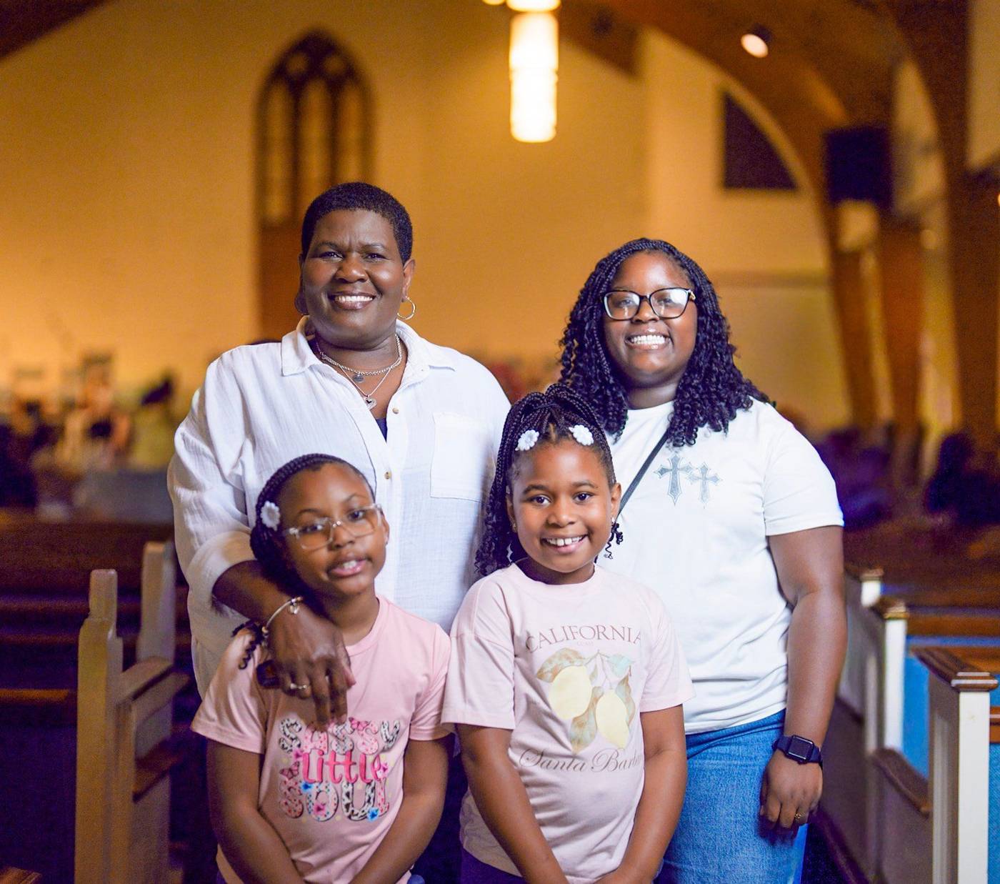 Women of Shiloh smiling together with two little girls